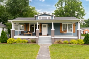 The cutest Craftsman Bungalow with rocking chair front porch. Original hardwood flooring throughout