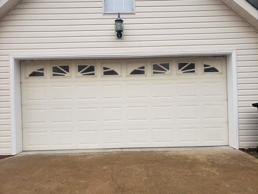 This is before photo of the White Recessed Garage Door. 
